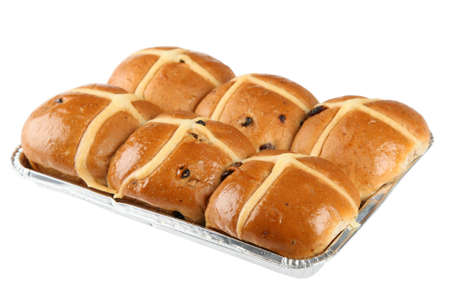 Plate of hot cross buns in tin foil isolated on white backgroundの写真素材