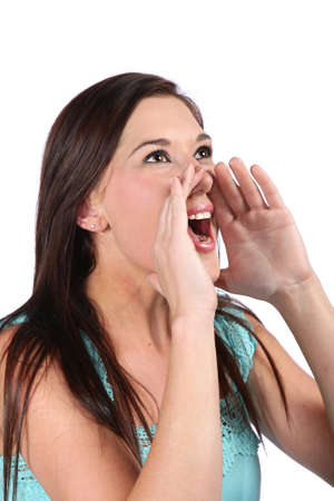 Pretty young woman shouting out good news announcementの写真素材