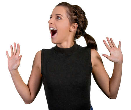 Pretty young lady with excited expression and hands out stretched