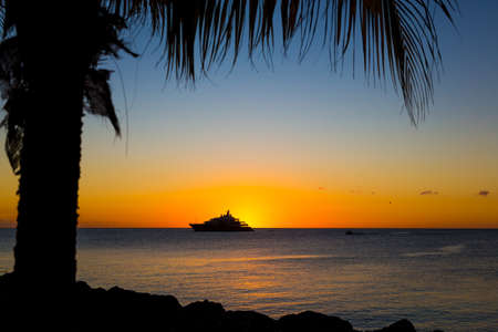 Luxury Yacht on the Sea at Sunset at a tropical islandの写真素材