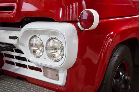 Detail of an old red vintage fire truck