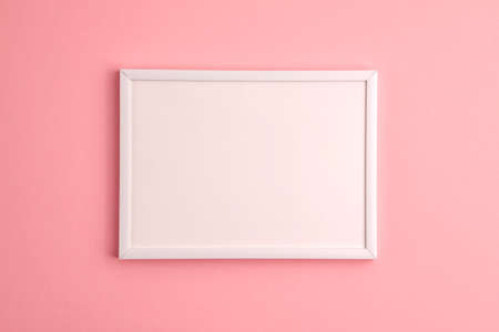 Mockup of white frame on pink background. Flat lay top view. Education template back to school and...