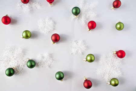 Decorative snow and christmas balls of red and green colors. Christmas concept flat layの写真素材