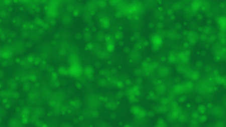 Bokeh bright green dreamy background with shiny glowing circle which are approaching like champagne bubble. For celebrating winter Holidays and Saint Patrick Day concept backdrop with copy spaceの写真素材
