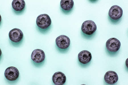 Macro pattern shot blueberry on bright background from adobe. Food and vegetarian concept with copy spaceの写真素材