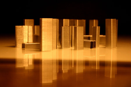 Business concept. City of staples. Simple staples looks like a city. Reflection of buildings on the water.の写真素材