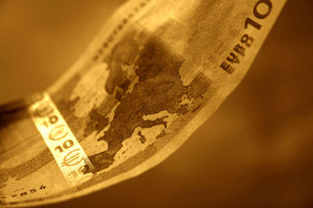 The close-up of 10 Euros. Toned with intense colours in retro style