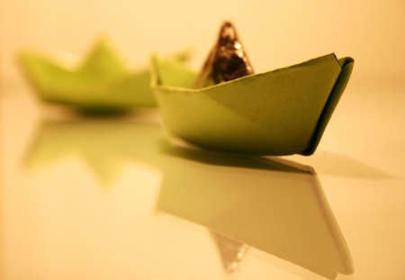 Paper ships, reflections on the glass.の写真素材