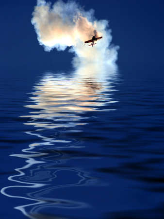 Airplane over the water, reflectionの写真素材