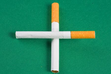 cigarette cross on greenの写真素材