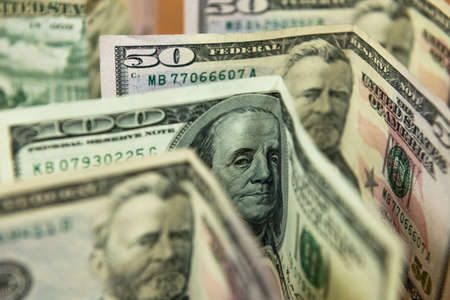 Thick wad of money cash on table