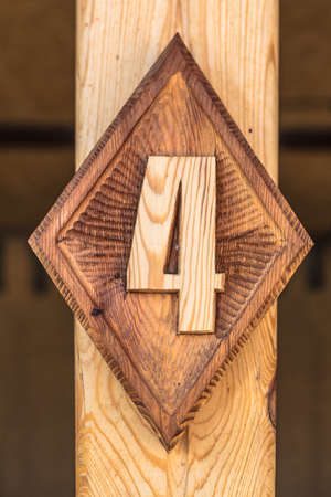 A figure carved from wood in the design of the building. high quality photo