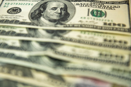 Thick wad of money cash on table. High quality photoの写真素材