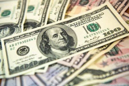 Thick wad of money cash on table. High quality photo