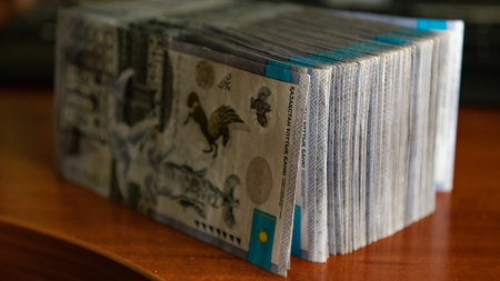 Thick wad of money cash on table. High quality photoの写真素材
