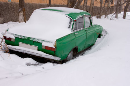 Old car in winter under the snow. High quality photoの写真素材