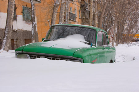 Old car in winter under the snow. High quality photoの写真素材