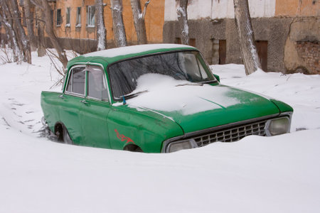 Old car in winter under the snow. High quality photoの写真素材
