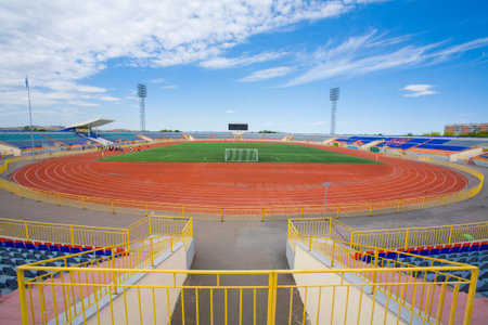 Football field with goal on blue skyの写真素材