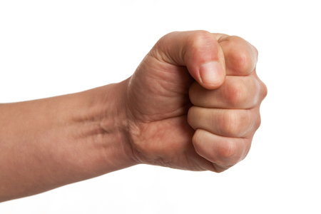 Hand power fist gesture isolated on white.