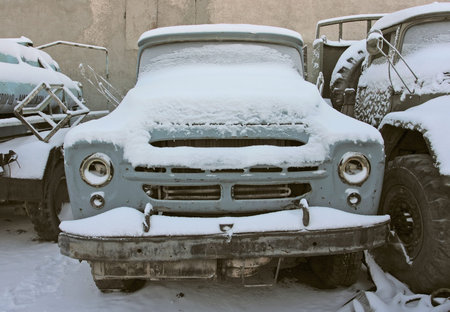 Old car in winter under the snow. High quality photoの写真素材