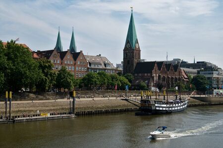 cityscape,city on the Weser River, travel, europe, tower,river, ship, tourismの写真素材