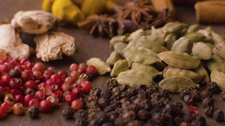 Macro shot indian spices on the table. Pepper, cardamom, ginger. Extreme close upの写真素材