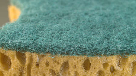 Extreme close up green double side dishwashing sponge. Texture, background. Macro shotの写真素材