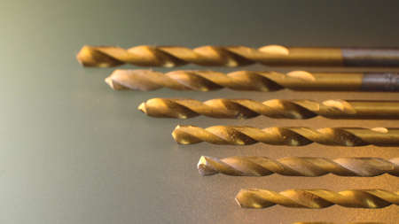 Extreme close up drill bit set on frosted glass background. Macro shotの写真素材