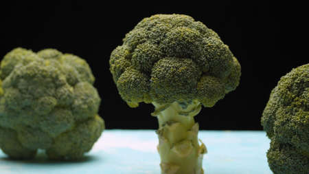 Close up fresh raw broccoli on black backgroundの写真素材