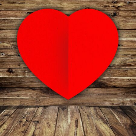 red heart on wood background の写真素材