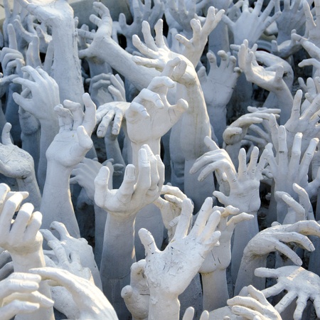 Hands Statue from Hell in Wat Rong Khun at Chiang Rai, Thailandの写真素材