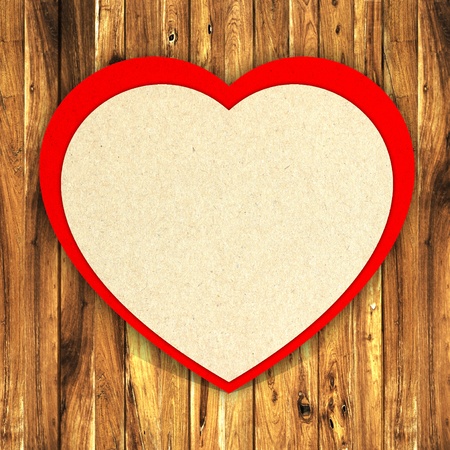 paper and red heart on wooden backgroundの写真素材
