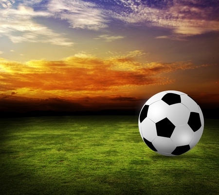 football field soccer on the green grass sunset skyの写真素材