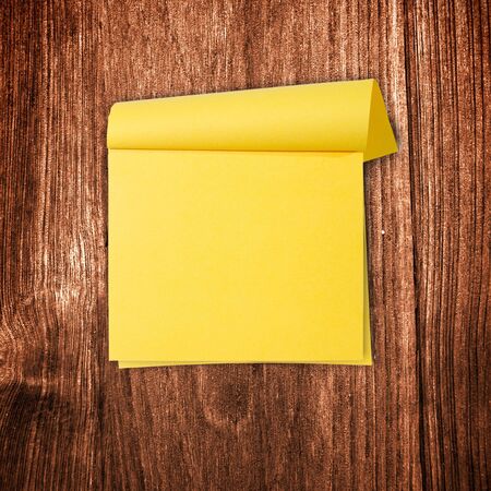close up of grunge note paper on wooden backgroundの写真素材