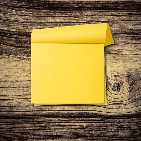 close up of grunge note paper on wooden backgroundの写真素材