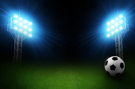 Green soccer field, bright spotlights, illuminated stadiumの写真素材