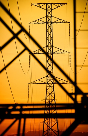 Silhouette of a high voltage postの写真素材