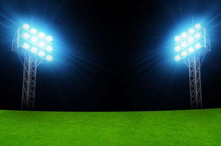 Green soccer field, bright spotlights, illuminated stadiumの写真素材