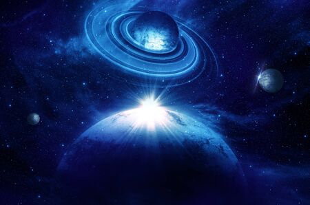 planet with sunrise on the background of starsの写真素材