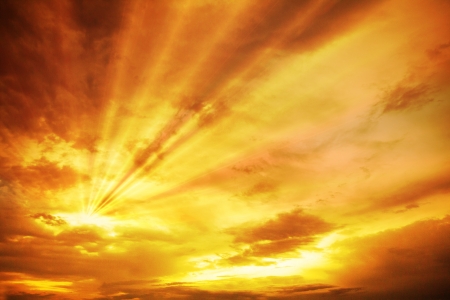 Sunset / sunrise with clouds, light rays and other atmospheric effectの写真素材