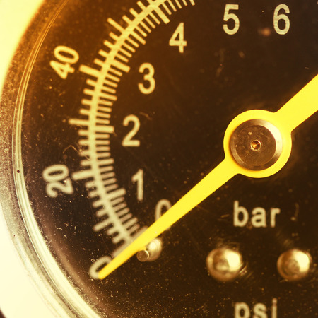 Closeup of a pressure meter on a machineの写真素材