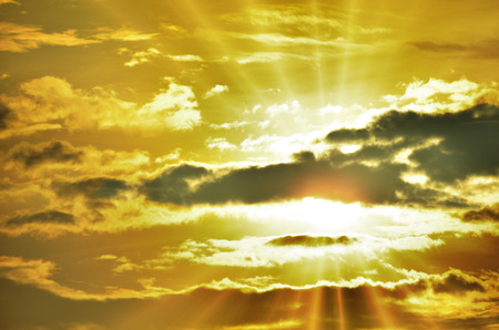 Sunset / sunrise with clouds, light rays and other atmospheric effectの写真素材