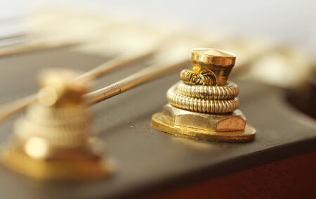 Close up of tuning peg on acoustic guitar headstockの写真素材