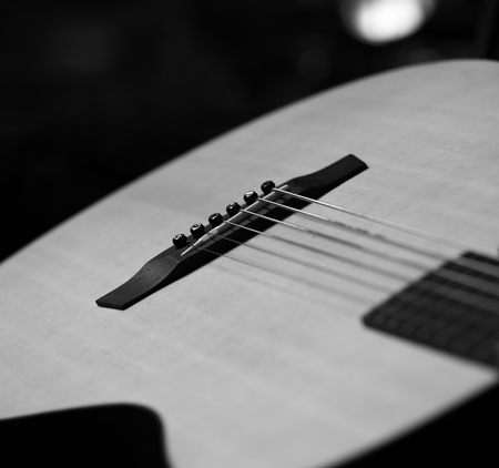 Acoustic Guitar with very shallow depth of field, focus on strings. Black & Whiteの写真素材