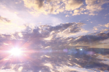 Sunset / sunrise with clouds, light rays and other atmospheric effectの写真素材
