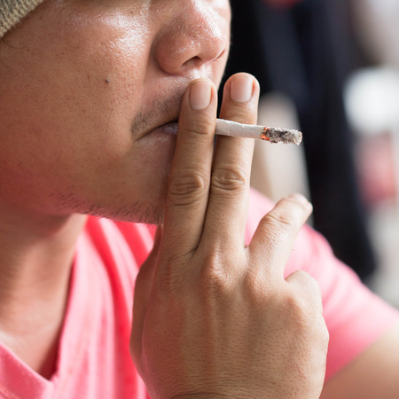 Man smoking cigaretteの写真素材