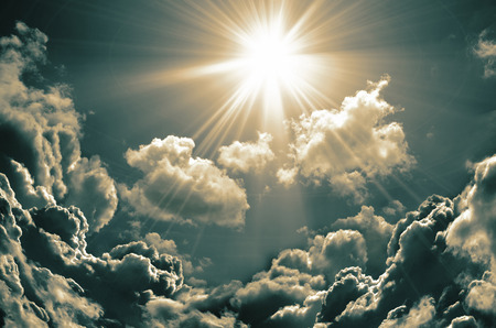Sunset / sunrise with clouds, light rays and other atmospheric effectの写真素材