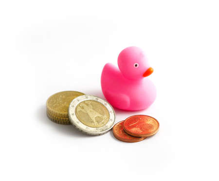 Pink rubber duck and German euro coins, isolated on a white background.の写真素材