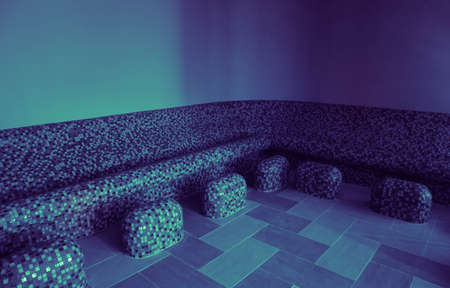 Tepidarium warm relaxing benches decorated with mosaic at the spa hotel. Tepidarium therapy room interior, wellness center.の写真素材